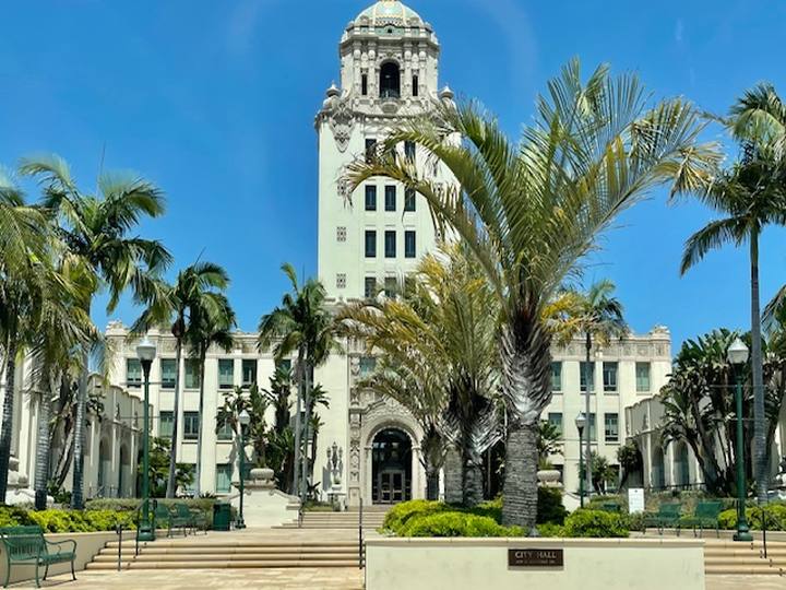 Beverly Hills City Hall and its tower framed by palm trees