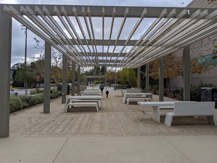 A long pergola shading benches and tables at Ishihara Park