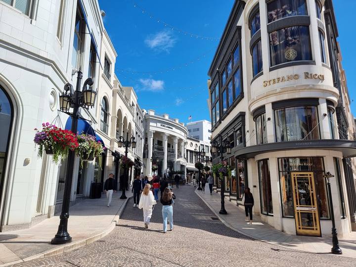 Shoppers walking past the storefronts of Rodeo Drive in Beverly Hills