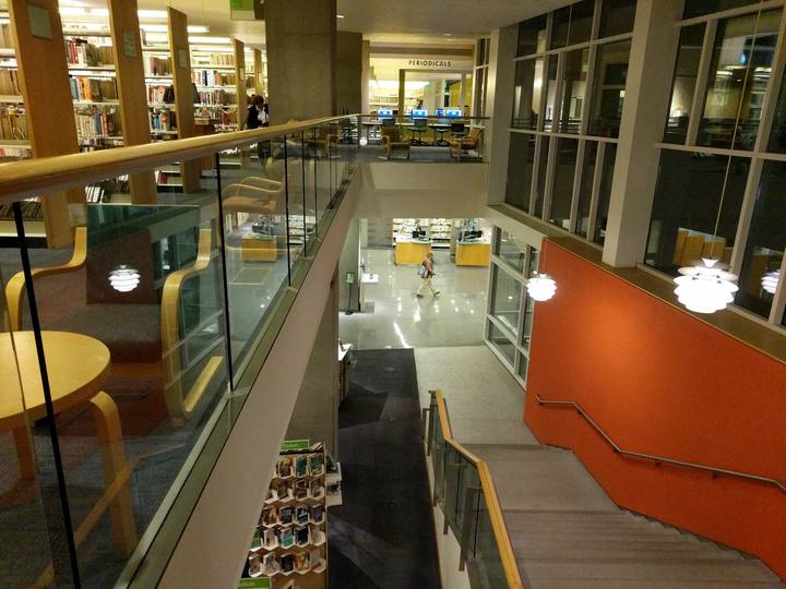 Bookshelves and an open stairway inside the Santa Monica Main Library