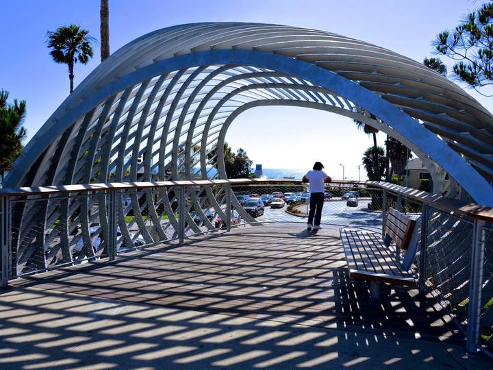 A curved steel lookout over a walkway in Tongva Park